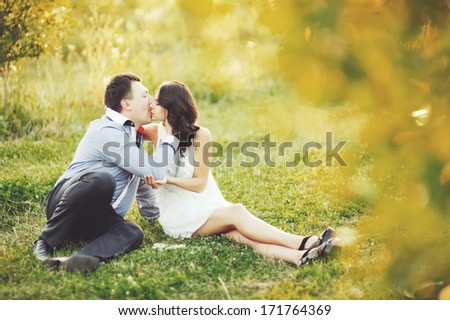 Couple having date, spending great time in garden on summer sunny day.