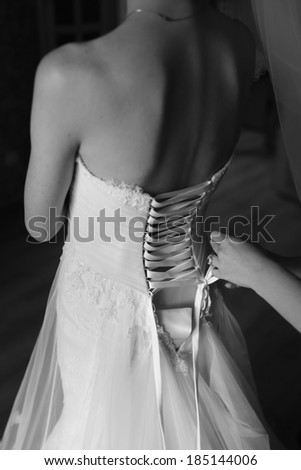Magic bridal morning. Bride getting ready. Black and white wedding picture.