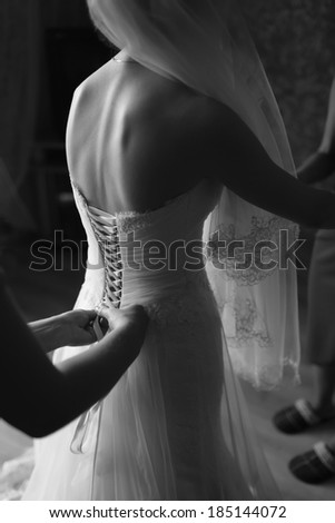 Magic bridal morning. Bride getting ready. Black and white wedding picture.