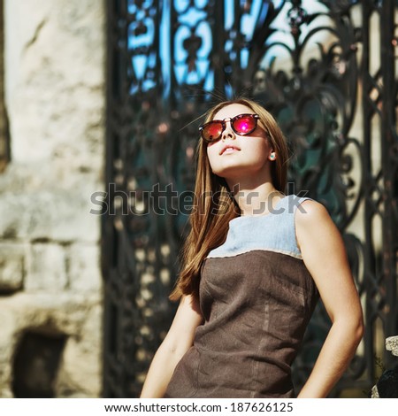 Beautiful teenage girl in sunglasses. Summer picture.