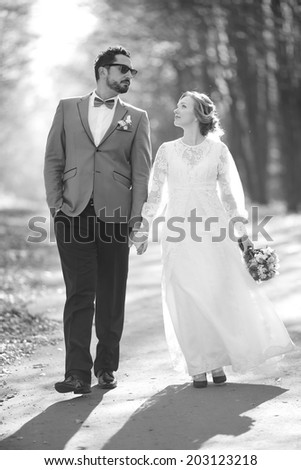 Newlywed caucasian couple together. Wedding day in black and white.