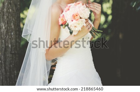 Beautiful bride enjoying happy wedding day.