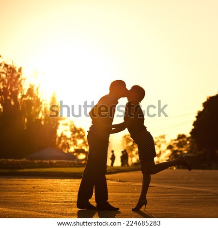Summer of our love. Young couple having date on sunset background.