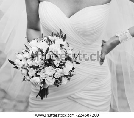 Beautiful young bride with bouquet.
