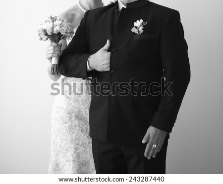 Happy wedding couple together. Picture in black and white.