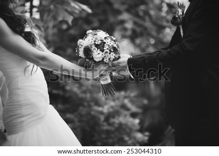 Bridal couple in love, wedding on summer day.  Picture in black and white.