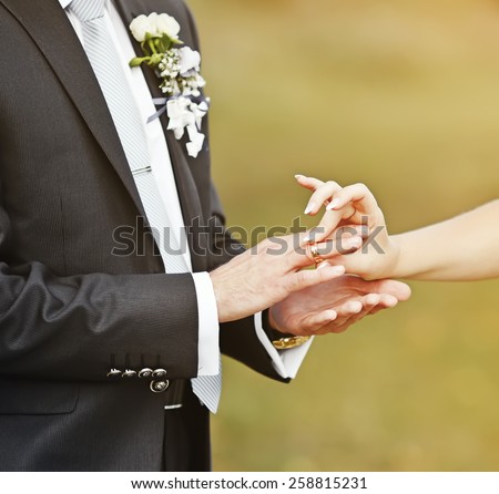 Marry me today and everyday. Newlywed couple holding hands, wedding picture.