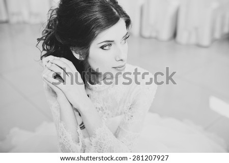 Happy bride posing. Wedding portrait in black and white.