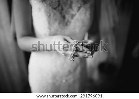 Happy bridal morning. Fiance getting ready. Wedding picture in black and white.