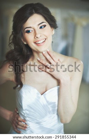 Wedding emotions of young happy bride.