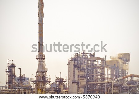 A rusty old oil refinery pumps out toxic waste.