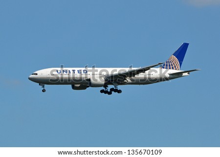 CHANTILLY, USA - SEP 23: United Airlines Boeing 777 lands on Sep 23, 2012 at Washington Dulles International Airport. United Airlines is a major US airline headquartered in Chicago, USA.