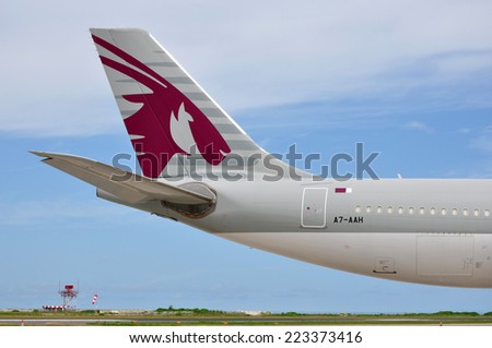 MALE, MALDIVES - SEPTEMBER 4, 2014: Tail section of a Qatar Airways Airbus A340 at Ibrahim Nasir International Airport. Qatar Airways is the state-owned flag carrier of Qatar.
