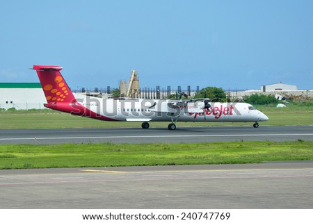 MALE, MALDIVES - SEPTEMBER 4, 2014: A SpiceJet Bombardier Dash 8 at Ibrahim Nasir International Airport. SpiceJet is a low-cost airline and is India\'s 2nd largest airline by domestic passenger share.