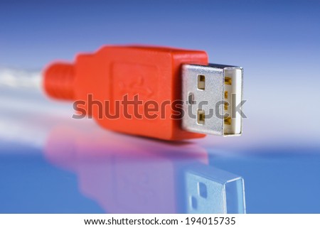 Computer USB Cable against blue background