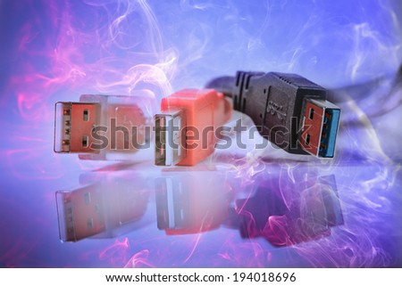 Computer USB Cables against abstract blue background