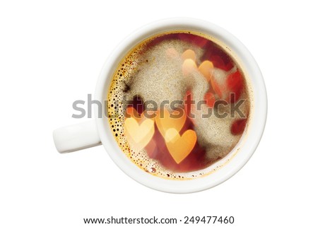 Double exposure of coffee cup and heart shaped defocused lights. Isolated on white background