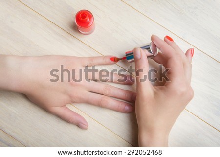 Manicure process at home, nails coating, top view