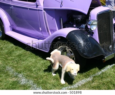 Vintage Classic Car with Dog Taking a Leak on the Wheel