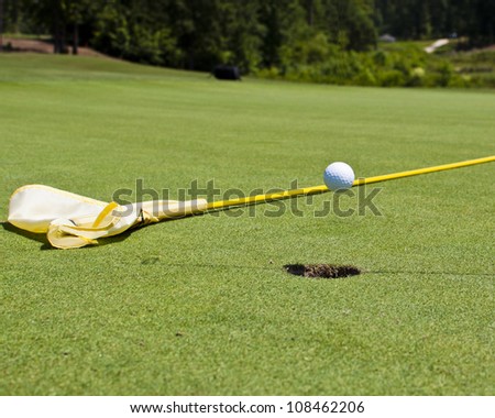 Golf ball in flight...hole in one