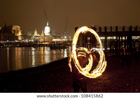 Fire Spinning Poi at the Thames, London