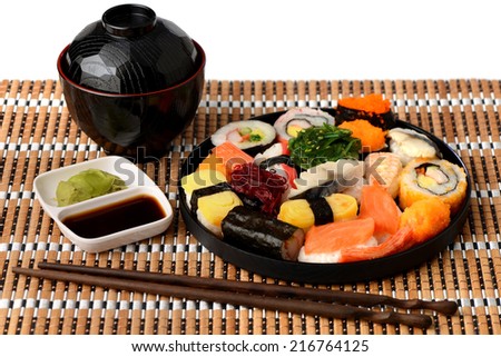 Set of Sushi Roll Japanese food with Miso soup and Chopsticks