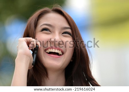 Beauty woman on phone laughing smile and looking up