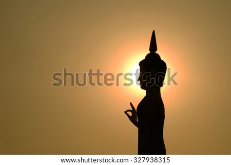 Silhouette head and face of Buddha image with and sky sunset or sunrise time