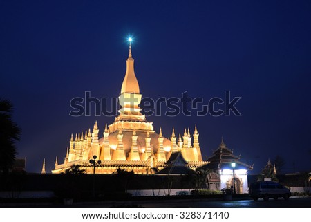 Night shot of Pha That Luang old golden Buddhist pagoda in Vientiane twilight time, Laos. This pagoda was several reconstructions now is one of Laos Landmark and famous place