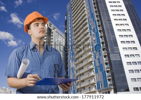 architect in helmet on a background of a new home
