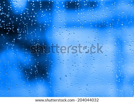 Water dropped on blue filtered background.