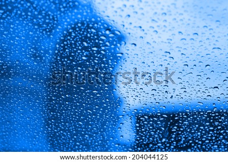 Water dropped on blue filtered background.