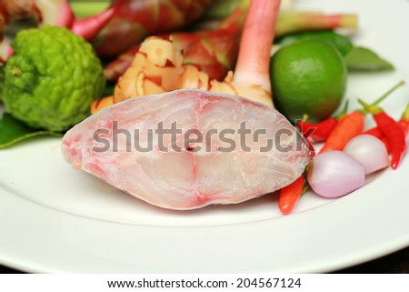 Raw fish with fresh herbs and spices (chili, lime, lemon grass, galangal  and kaffir lime)