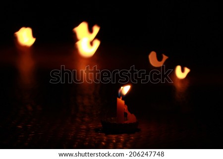 Candle Lighting bird shape bokeh .