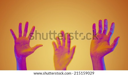 raising hands on yellow background.