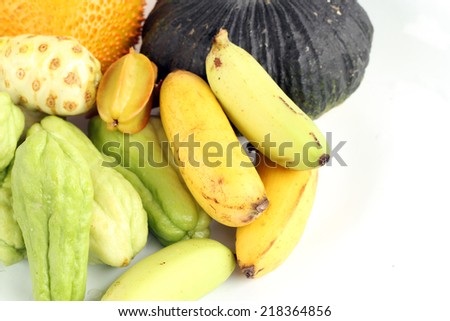 Banana with fruit on white background.
