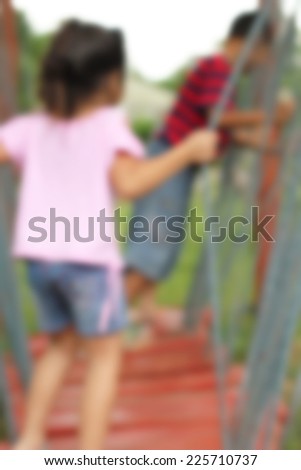 Blurred Children play in play ground activity.Blurred activity background.