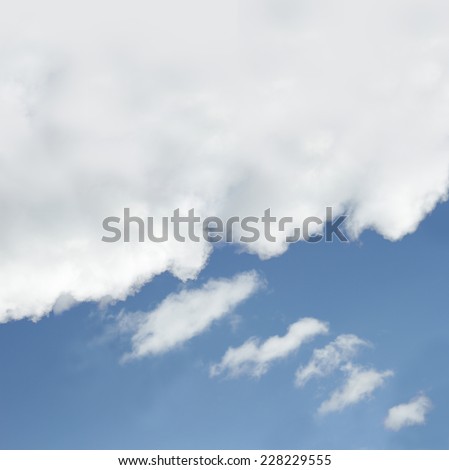 White cloud in the sky with the shape of a cartoon thinking balloon