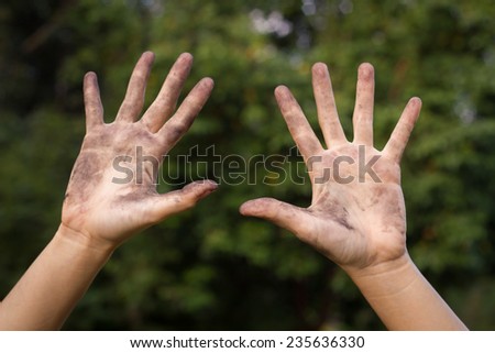 Dirty hands raising up.