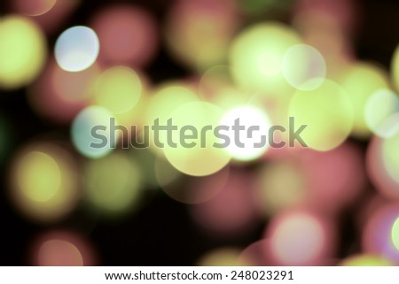 Abstract blurred light in the dark background.