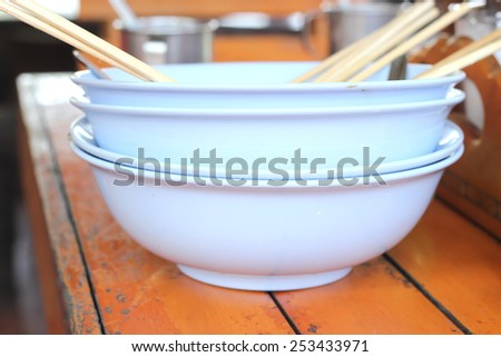 Empty bowl of noodle after eat and it\'s dirty. Empty bowl in cafeteria.
