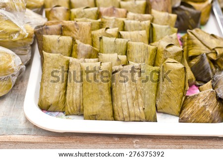 Thai traditional sticky rice dessert in banana leaf packaging.Khow Thom Mud.