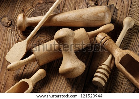 wooden kitchen utensils on aged wood