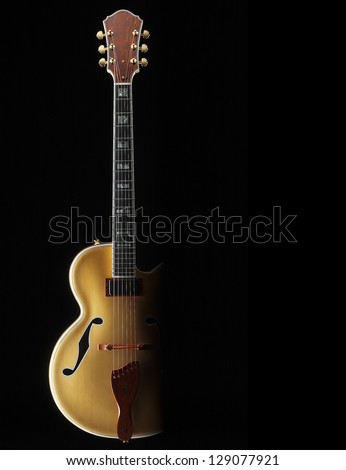 jazz guitar faded on black background
