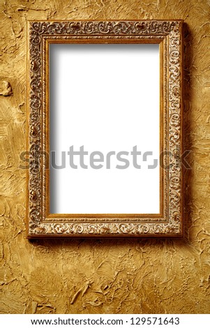antique golden frame on aged concrete wall