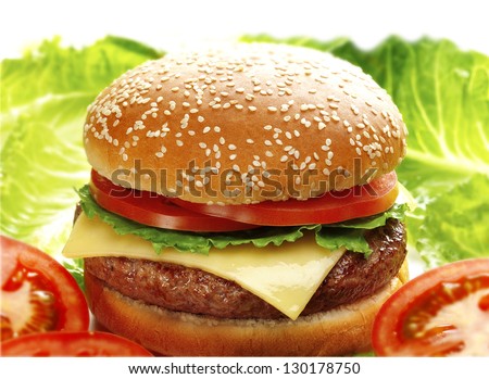 cheese burger served with lettuce and tomato