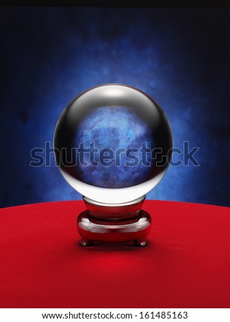 fortune teller crystal ball on red desk