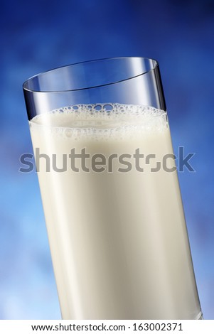 soy drink glass on blue background