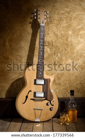 jazz guitar with bourbon bottle