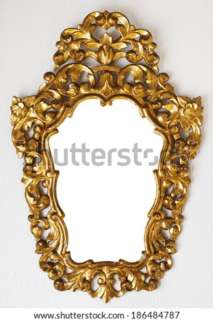 golden romantic old frame on white wall, blank